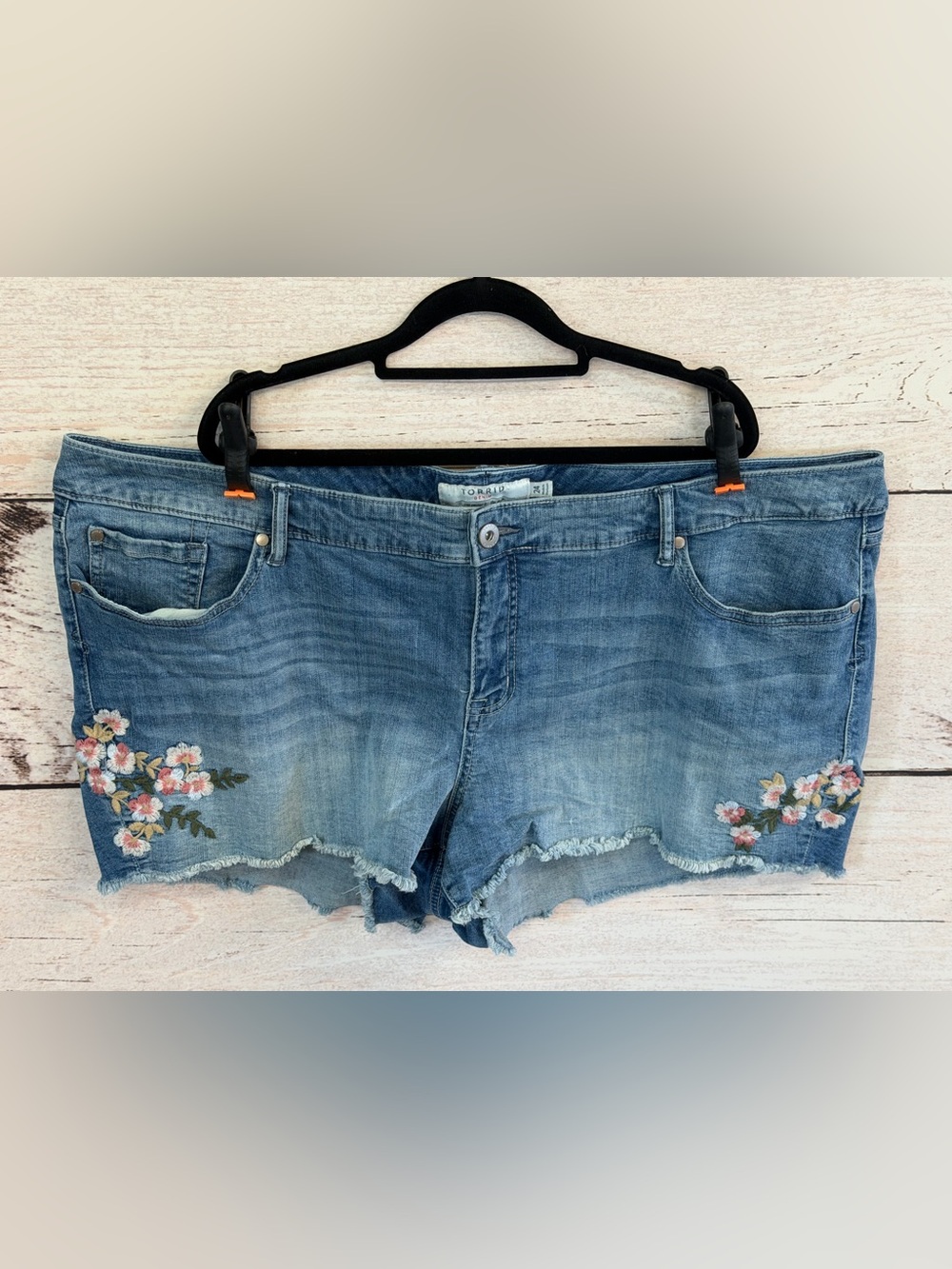 Torrid faded blue denim shorts with frayed hem